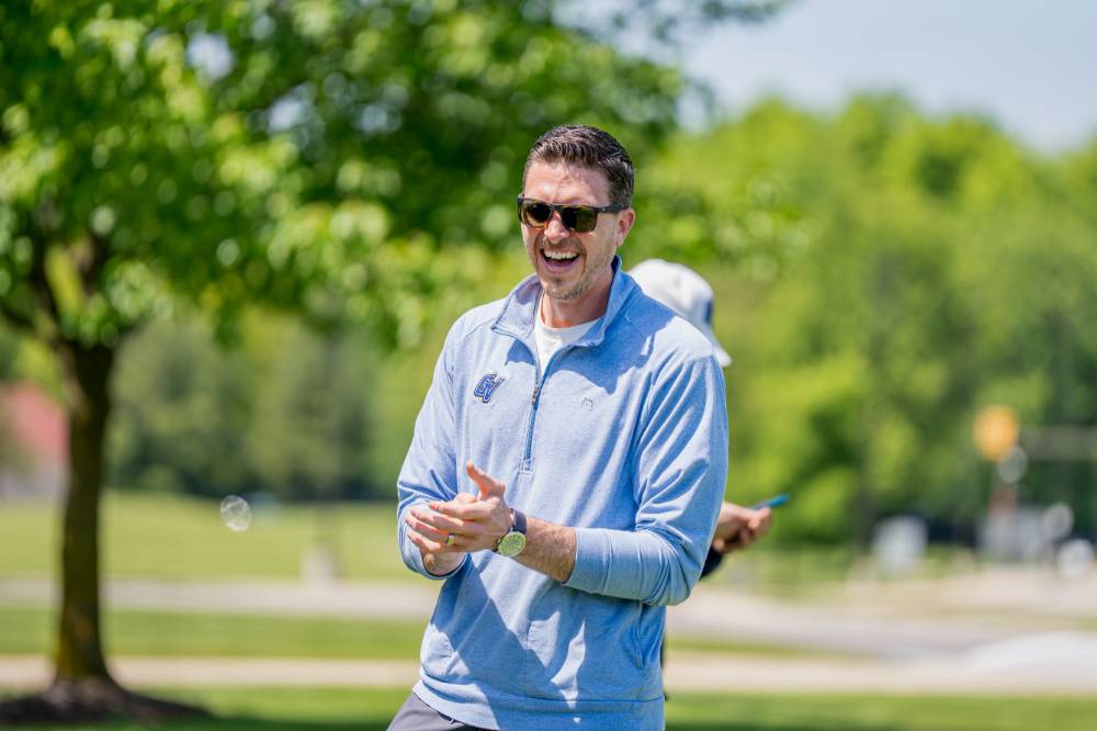 The winning team smiles and claps after the game